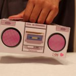 powerpuff girl tissue box made in the shape of a boom box. the tissue box is pink and has bottons on it. a handle was included so when you are on the go you can carry your tissues with ease.